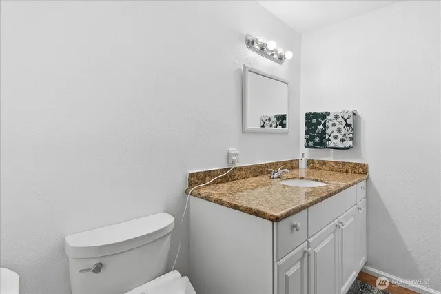 a bedroom with two beds and painted walls