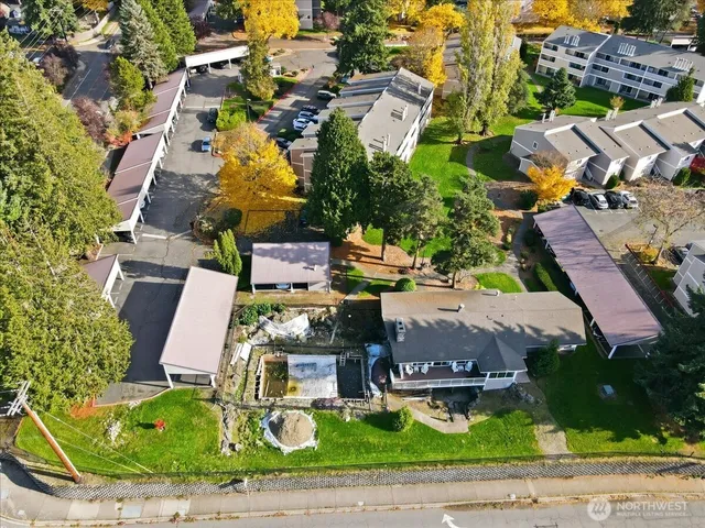 an aerial view of residential houses with outdoor space