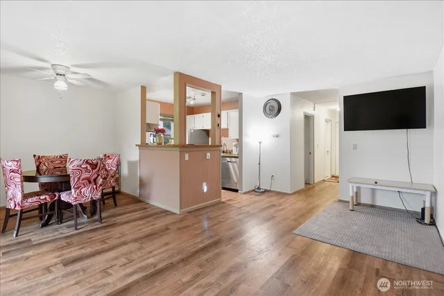 a view of a livingroom with a dining room and a window
