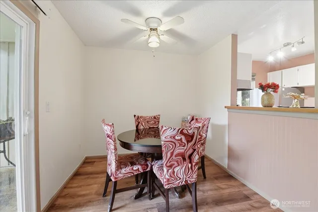 a view of a dining room with furniture window and outside view