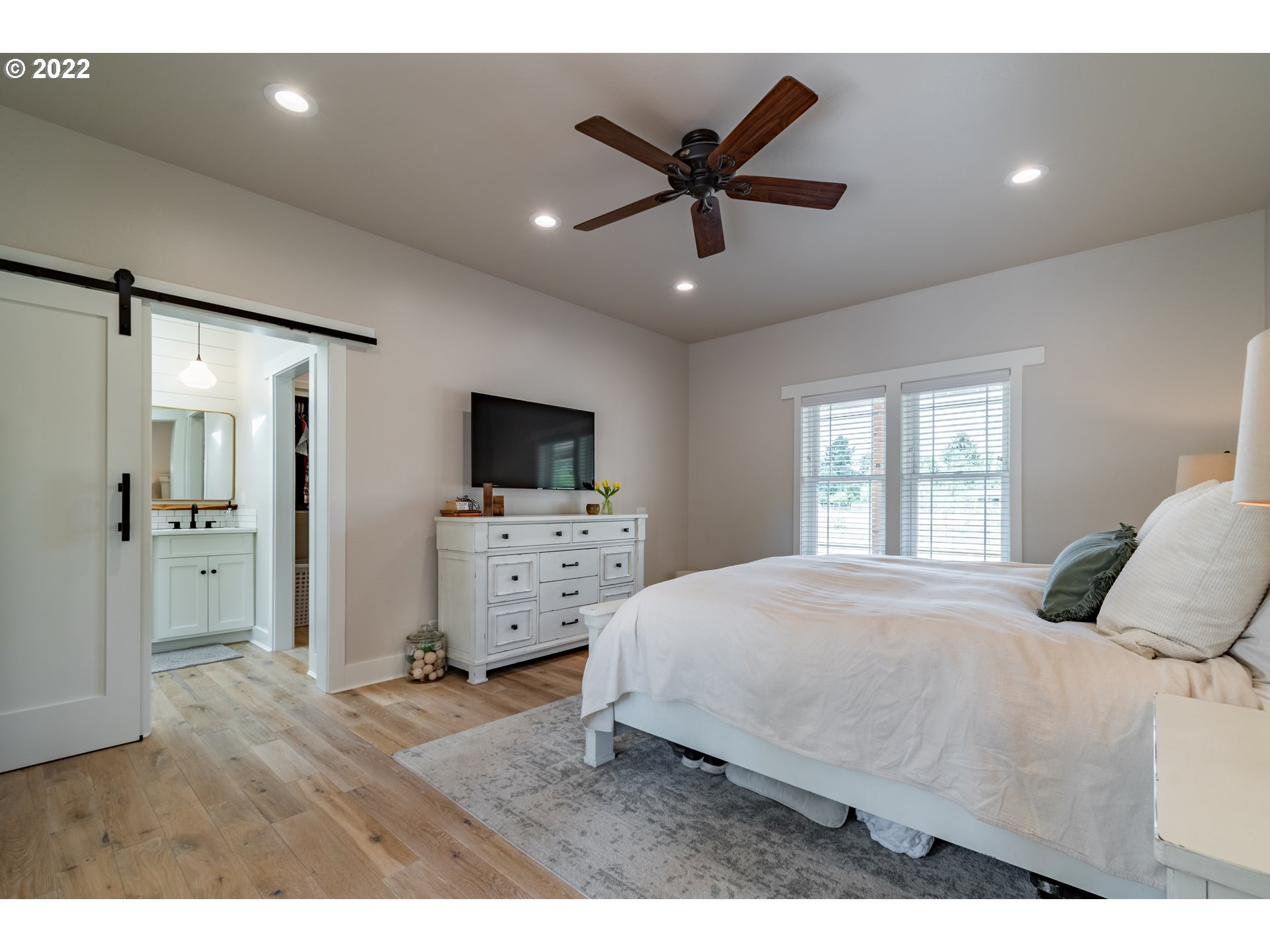 37190 Wheeler Road Pleasant Hill, OR 97455 - Photo 11 of 29 a bedroom with a bed and a flat screen tv