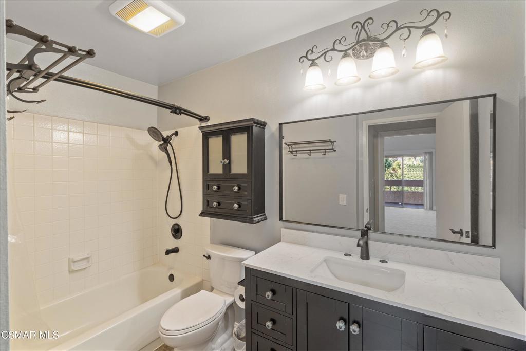 3306 Darby Street, Unit 402 Simi Valley, CA 93063 - Photo 11 of 31 a bathroom with a sink a toilet and shower