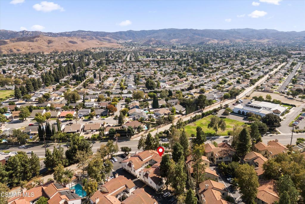 3306 Darby Street, Unit 402 Simi Valley, CA 93063 - Photo 15 of 31 an aerial view of residential house with parking and mountains