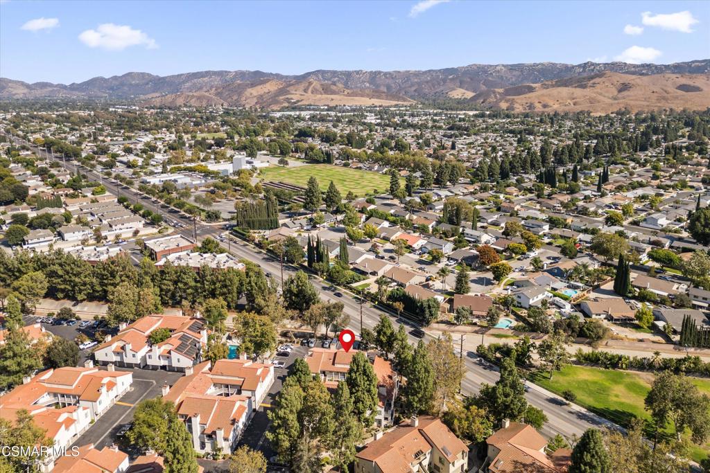 3306 Darby Street, Unit 402 Simi Valley, CA 93063 - Photo 22 of 31 an aerial view of residential houses with outdoor space and trees