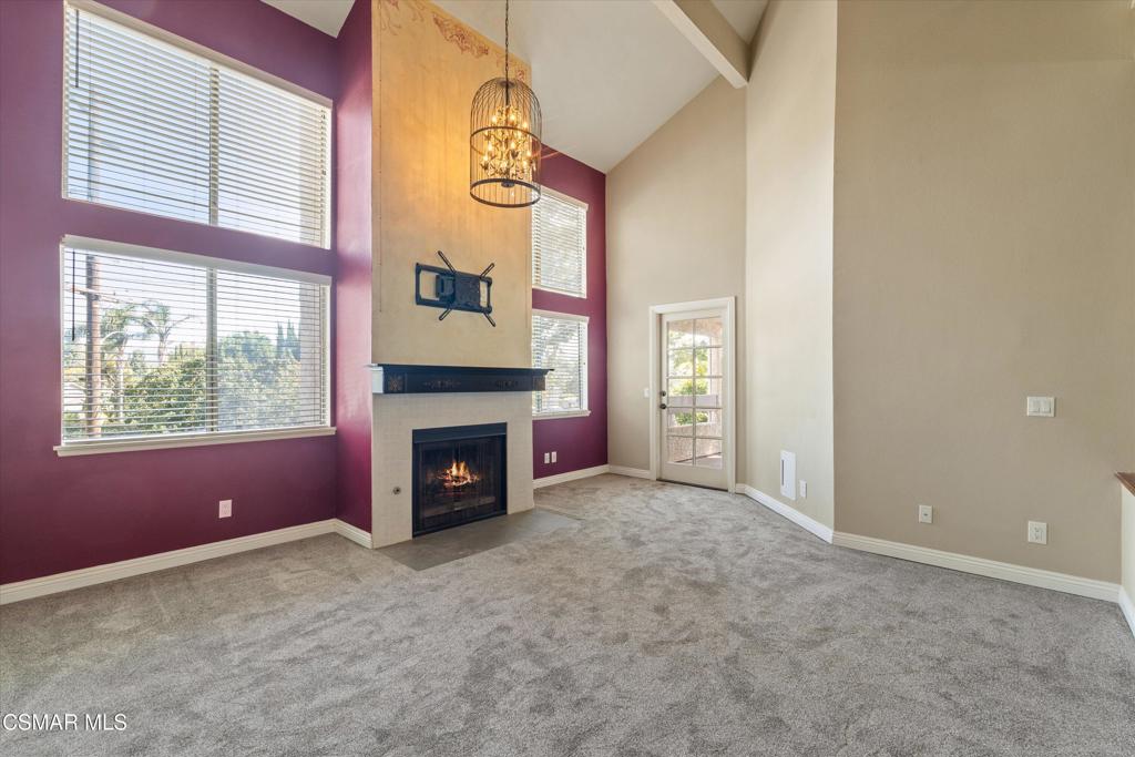 3306 Darby Street, Unit 402 Simi Valley, CA 93063 - Photo 4 of 31 an empty room with windows fire place and a fireplace