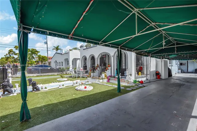 a view of a chairs and table in the patio