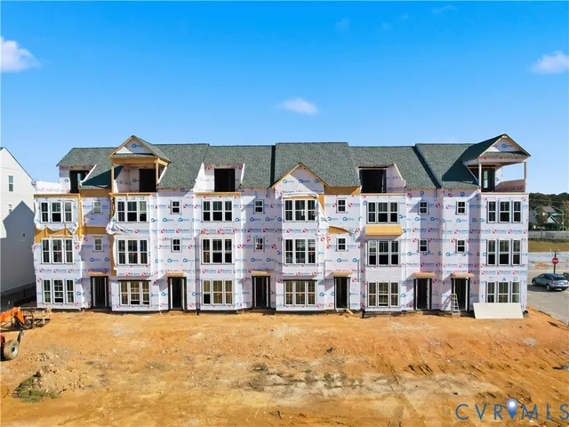 a front view of a building with a ocean view