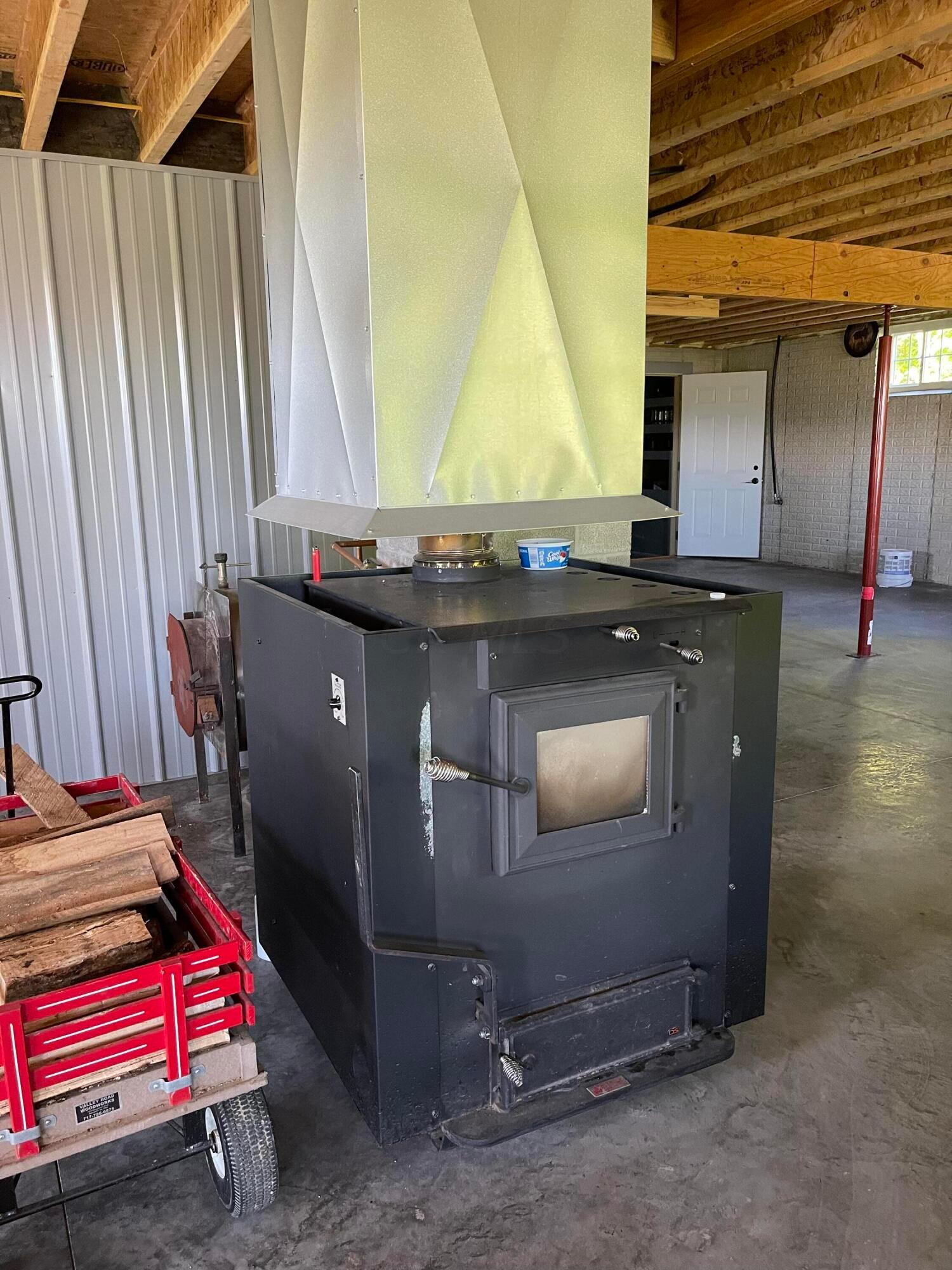 150 James Bowen Road Jackson, OH 45640 - Photo 29 of 43 Wood stove heats entire home located in basement