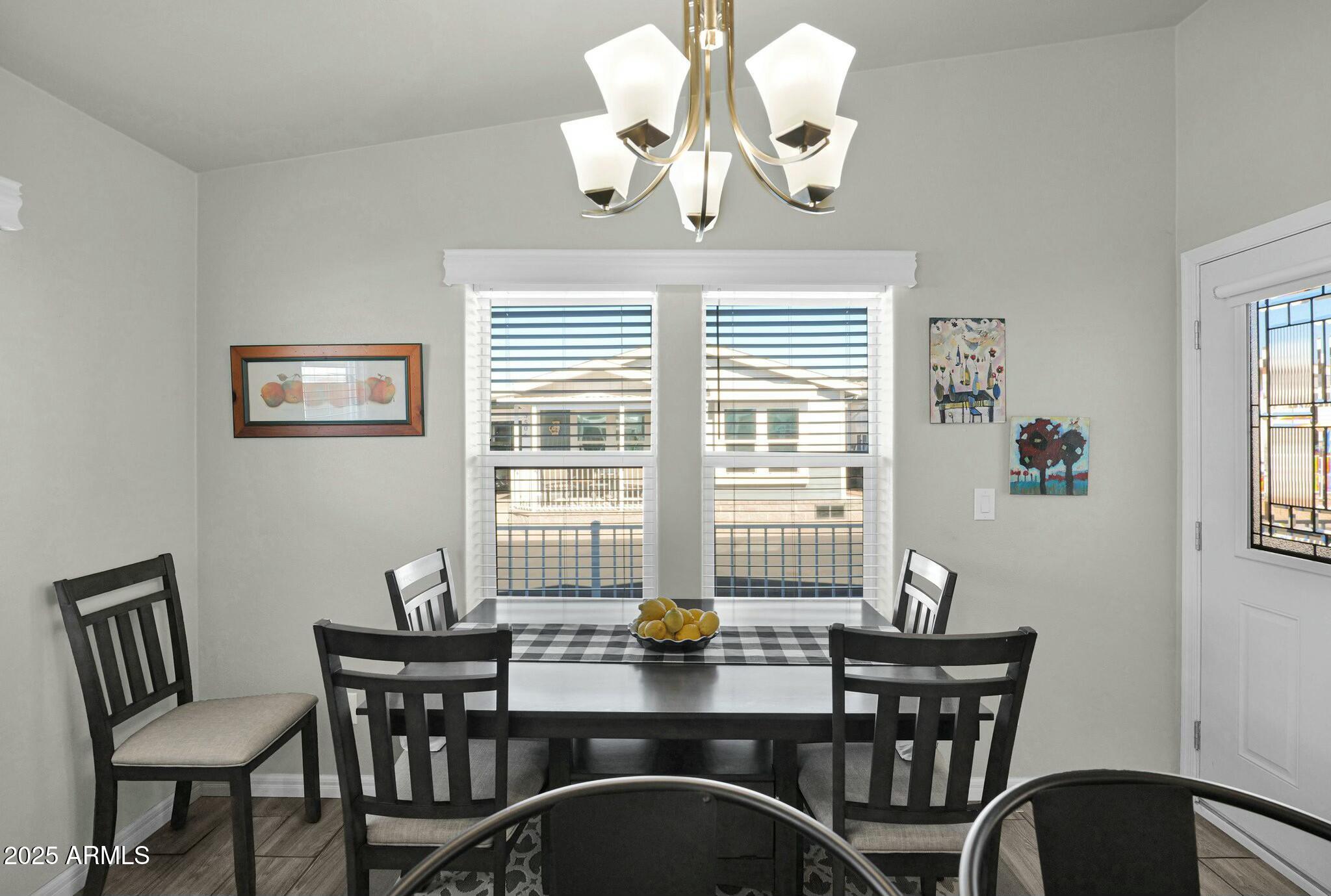 650 North Hawes Road, Unit 3505 Mesa, AZ 85207 - Photo 15 of 46 a view of a dining room with furniture window and outside view