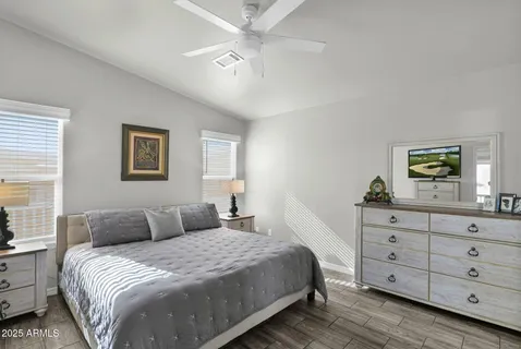 a bedroom with a bed and a dresser