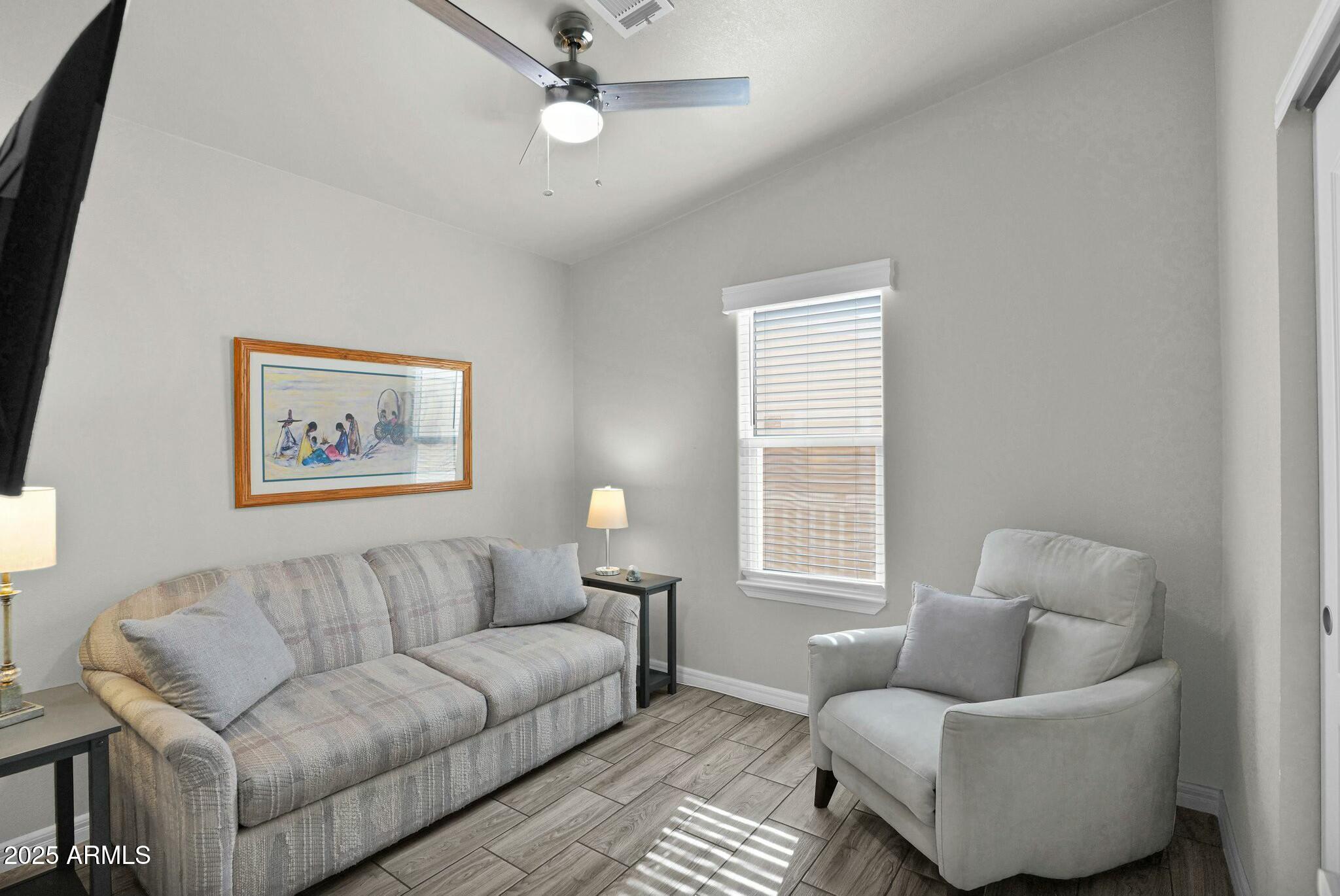 650 North Hawes Road, Unit 3505 Mesa, AZ 85207 - Photo 21 of 46 a living room with furniture and a window