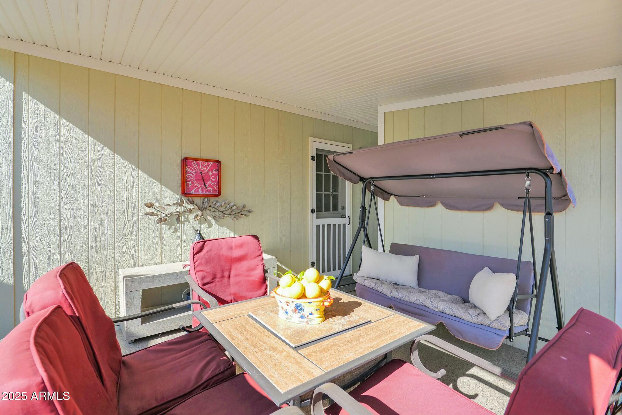 650 North Hawes Road, Unit 3505 Mesa, AZ 85207 - Photo 25 of 46 a living room with furniture a rug and a table