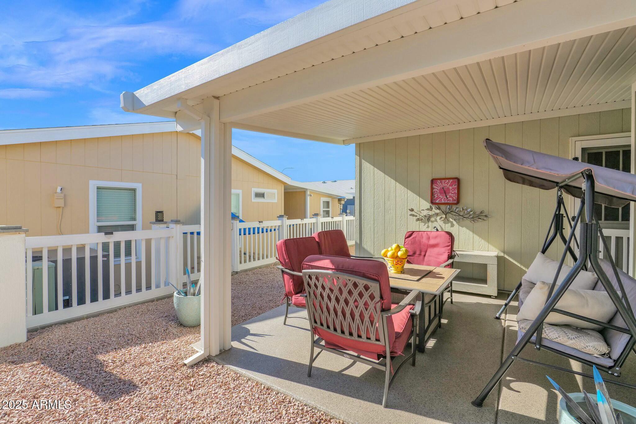 650 North Hawes Road, Unit 3505 Mesa, AZ 85207 - Photo 27 of 46 a outdoor space with chairs