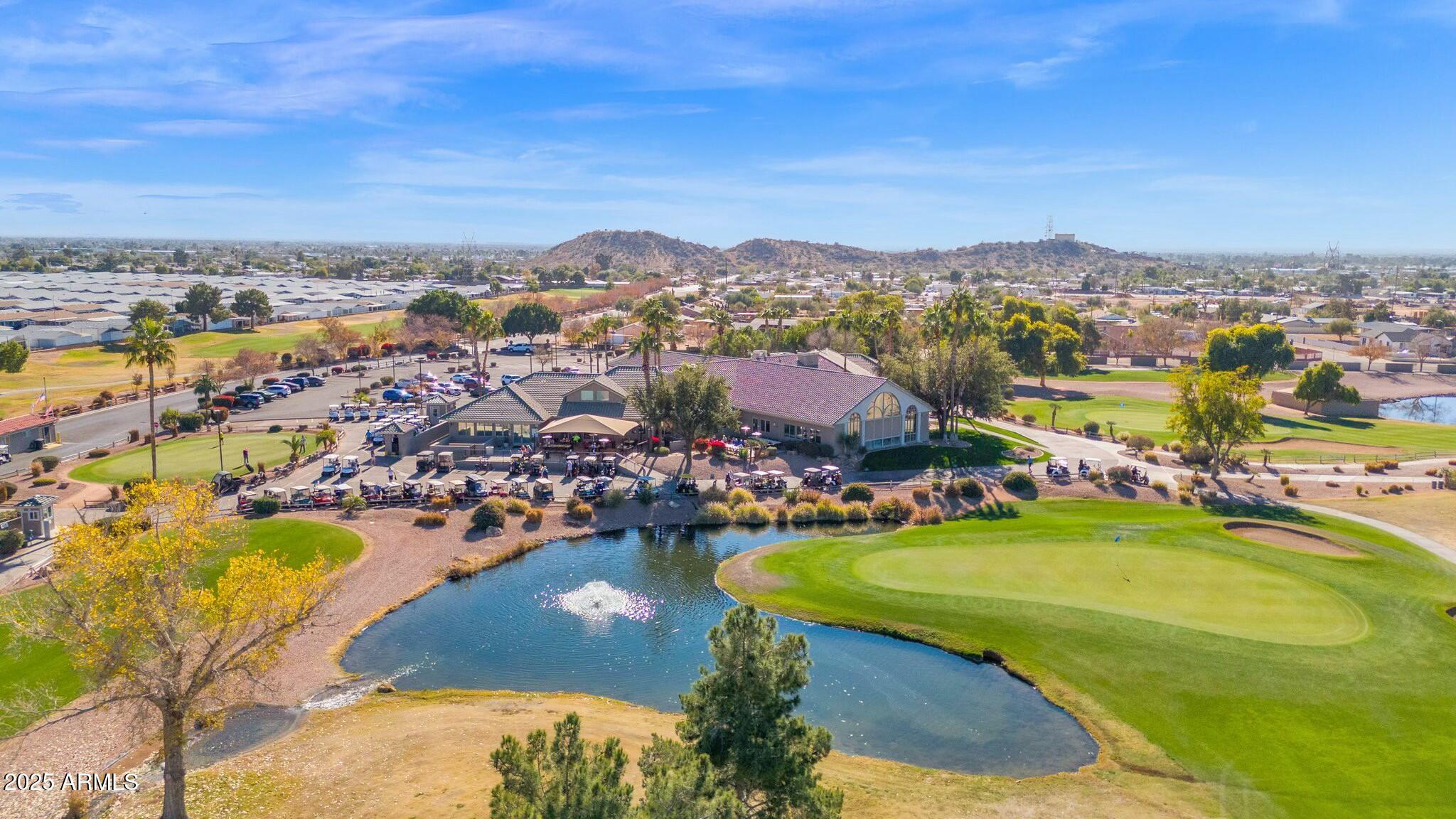 650 North Hawes Road, Unit 3505 Mesa, AZ 85207 - Photo 39 of 46 an aerial view of a city with lots of residential buildings ocean and mountain view in back