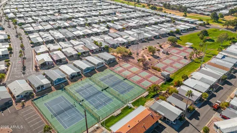 an aerial view of a residential apartment building with a yard