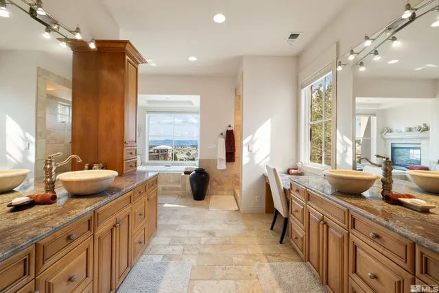 a kitchen with counter top space and living room