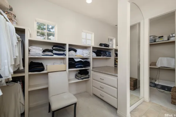 a kitchen with a refrigerator and a stove