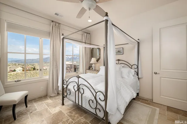 a bathroom with a bathtub and windows