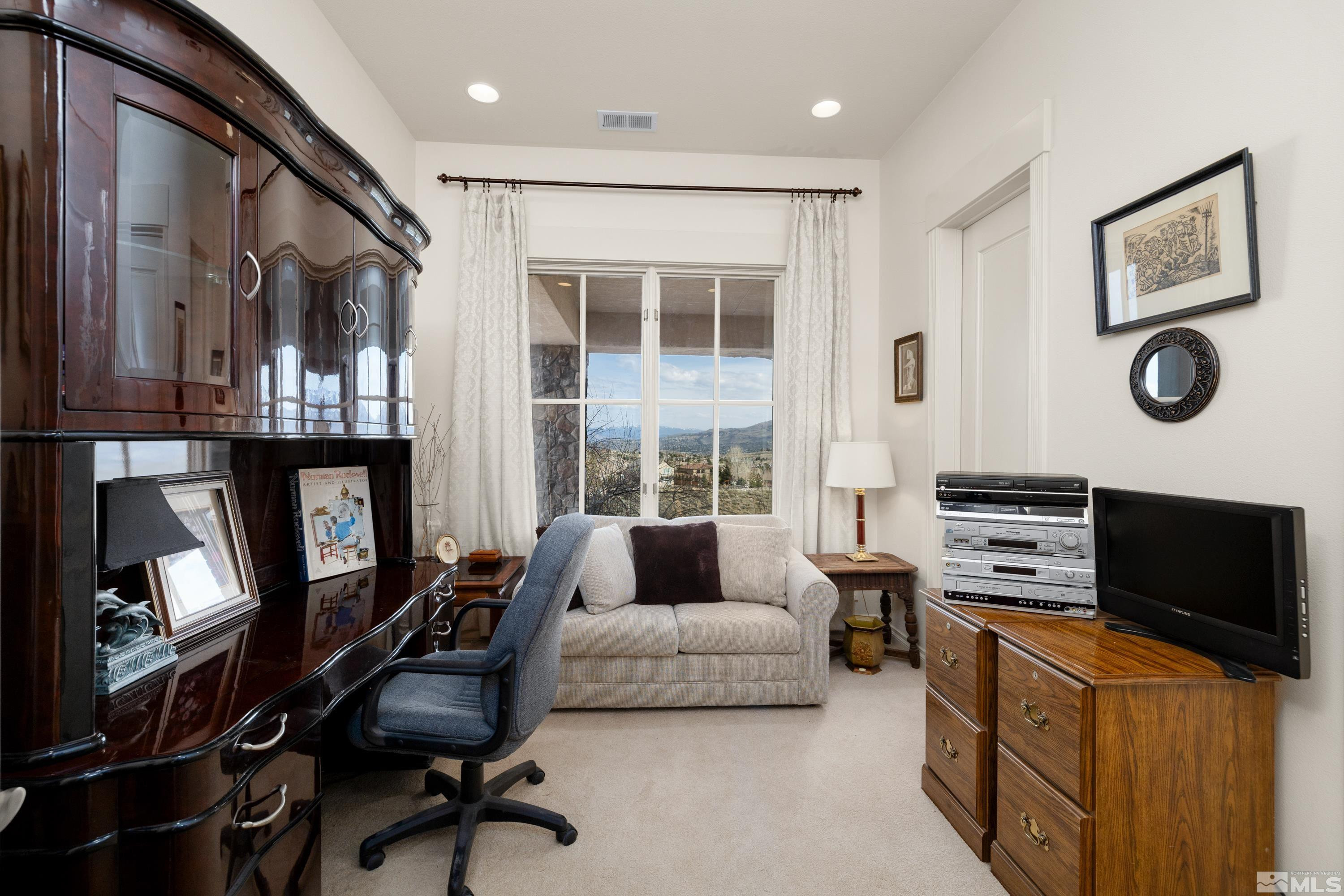 2440 Mountain Spirit Trail Reno, NV 89523 - Photo 30 of 34 a living room with furniture and a flat screen tv