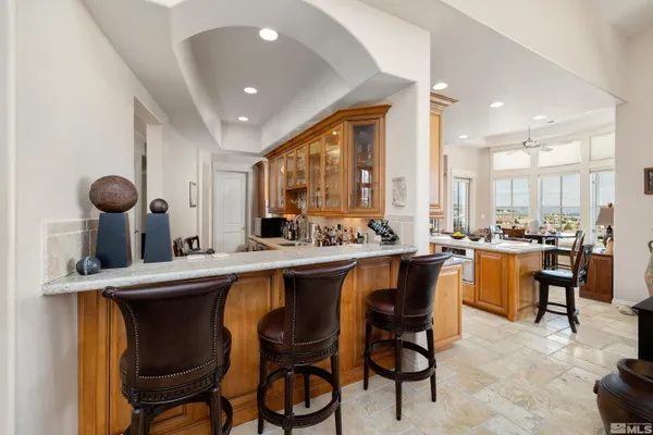 a large kitchen with a table and chairs