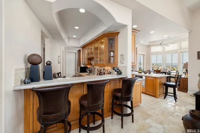 a large kitchen with a table and chairs