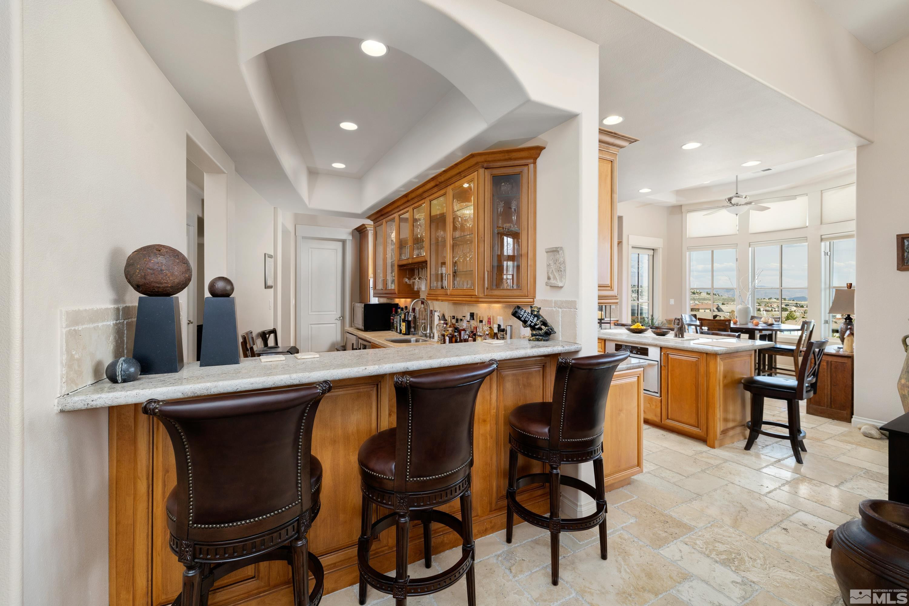 2440 Mountain Spirit Trail Reno, NV 89523 - Photo 5 of 34 a large kitchen with a table and chairs