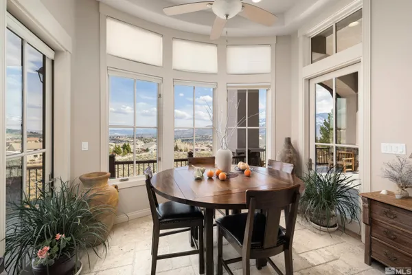 a view of a dining room with furniture window and outside view
