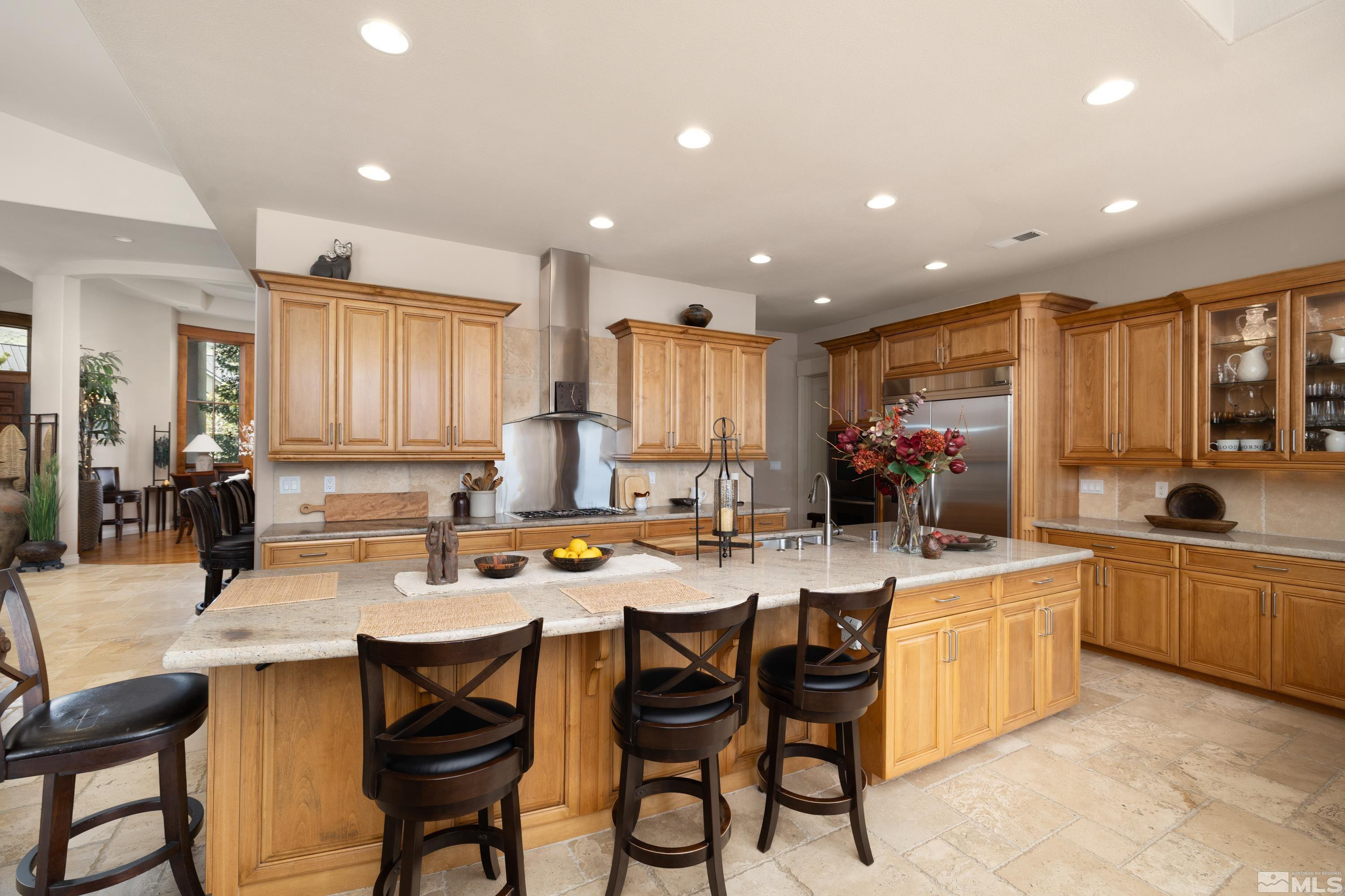 2440 Mountain Spirit Trail Reno, NV 89523 - Photo 9 of 34 a kitchen with a sink and chairs