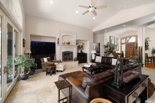 a living room with furniture fireplace and flat screen tv
