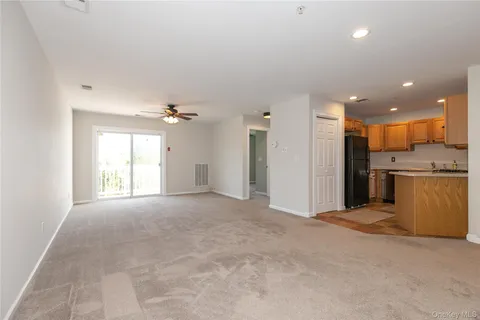 a view of a kitchen with a sink and a window