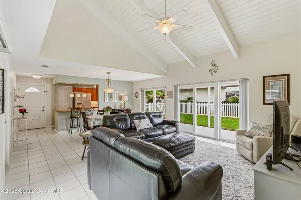 a view of a house with backyard porch and garden