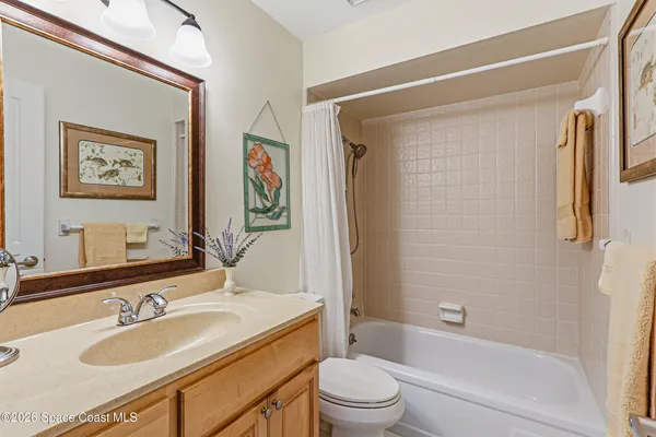 a view of a lake with houses in the back