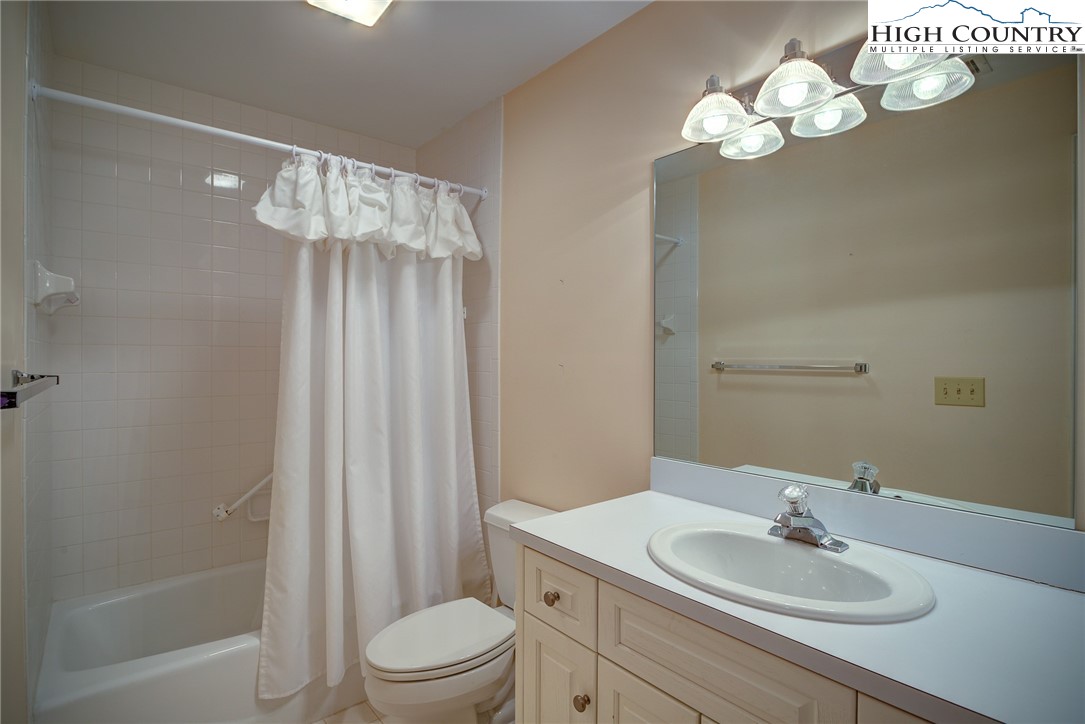 151 Deer Valley Drive, Unit 234 Boone, NC 28607 - Photo 13 of 22 a bathroom with a sink a toilet and shower