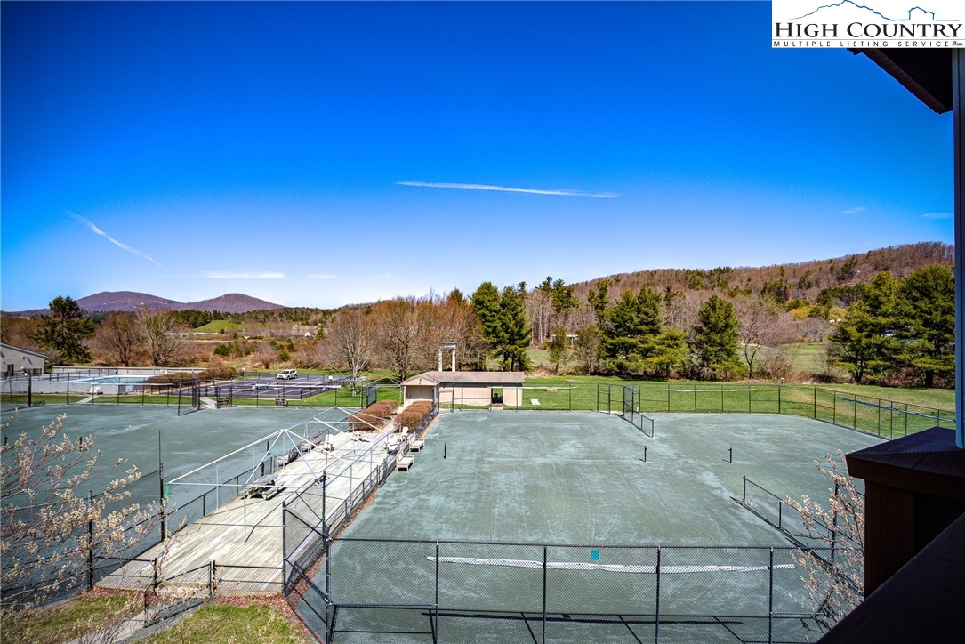 151 Deer Valley Drive, Unit 234 Boone, NC 28607 - Photo 18 of 22 a view of a lake with a yard