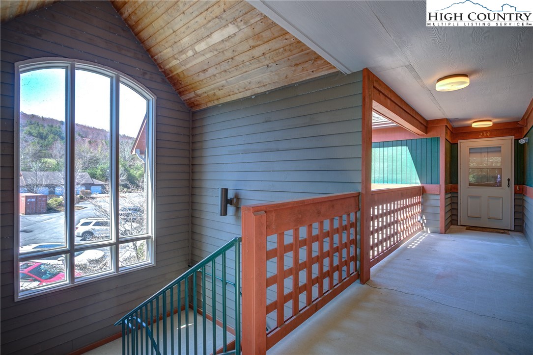 151 Deer Valley Drive, Unit 234 Boone, NC 28607 - Photo 2 of 22 a view of a porch with wooden floor