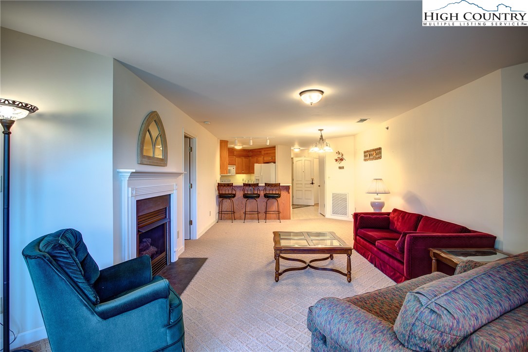 151 Deer Valley Drive, Unit 234 Boone, NC 28607 - Photo 6 of 22 a living room with furniture fireplace and couch