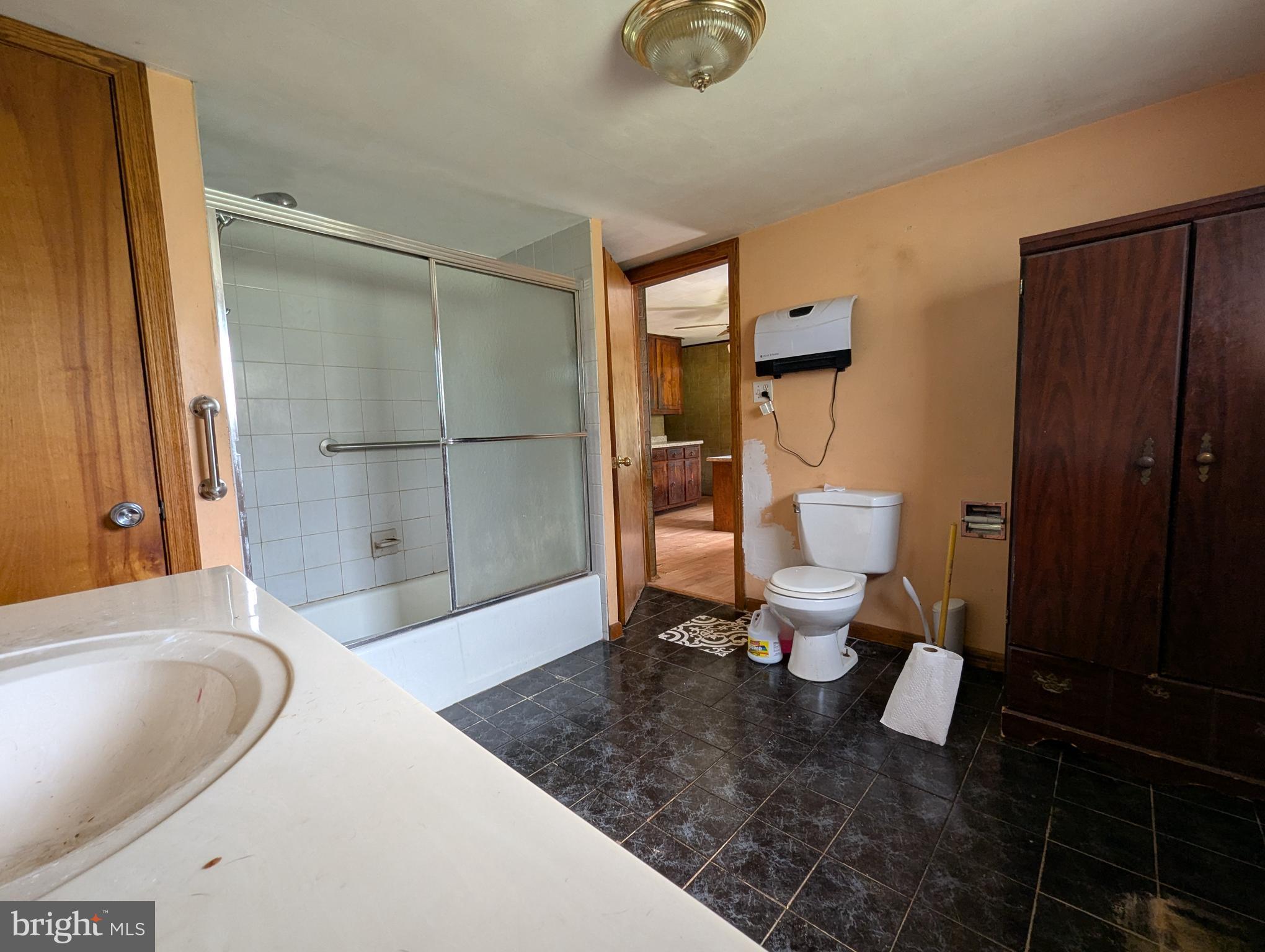 24001 Perry Hill Road Barton, MD 21521 - Photo 28 of 37 a bathroom with a sink toilet and shower