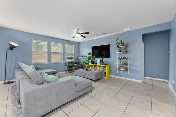 a view of an empty room and wooden floor