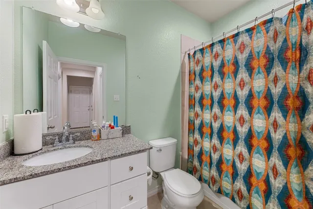 a view of a livingroom with workspace and a window