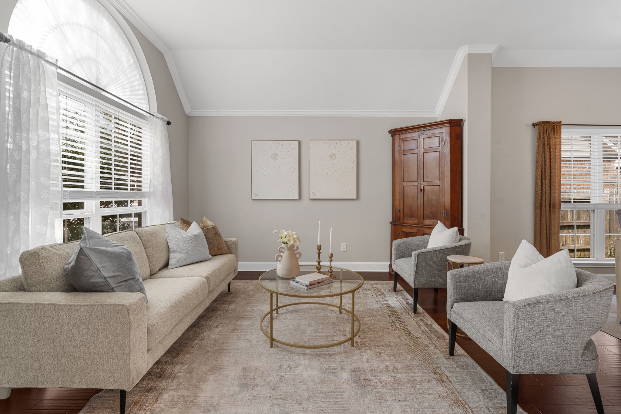 3426 Summer Ranch Drive Katy, TX 77494 - Photo 4 of 48 The formal living room offers a refined space to welcome guests, featuring warm engineered wood flooring, soft neutral tones, and an inviting setting perfect for conversation or quiet relaxation.