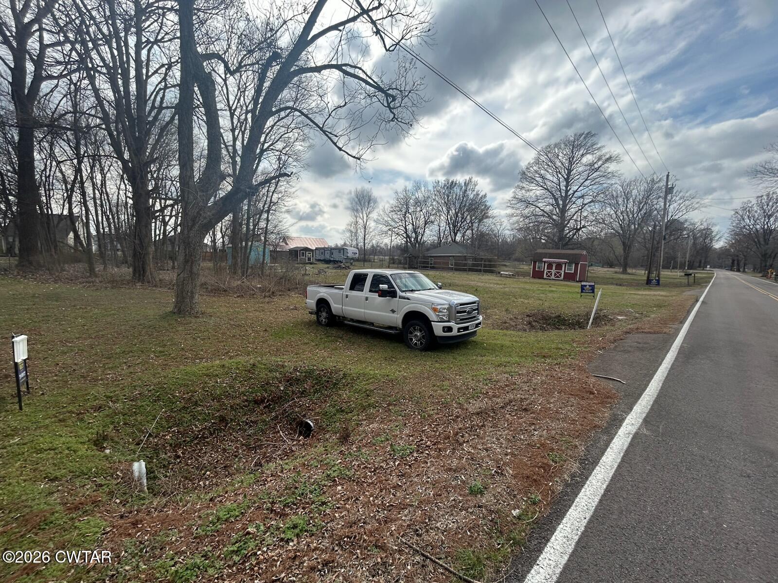 935 Magnolia Road Tiptonville, TN 38079 - Photo 4 of 4 a car parked in front of a house