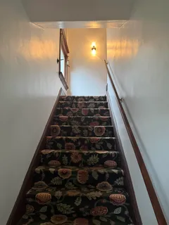 a living room with fireplace furniture and a flat screen tv