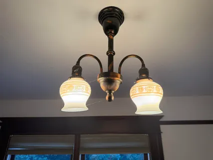 a bathroom with a sink a toilet a mirror and shower