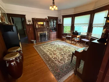a view of a dining room with furniture and window