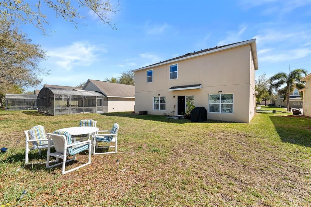754 Andalusia Loop Davenport, FL 33837 - Photo 22 of 28 a front view of a house with a yard