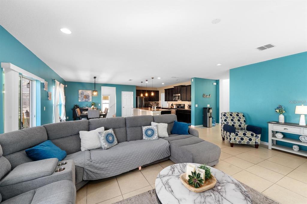 754 Andalusia Loop Davenport, FL 33837 - Photo 9 of 28 a living room with furniture and a couch