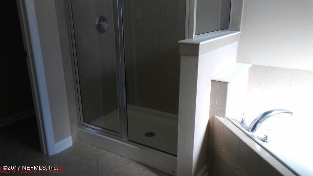 3421 South Saxxon Road St. Augustine, FL 32092 - Photo 11 of 13 a bathroom with a shower