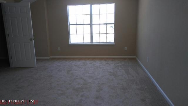 3421 South Saxxon Road St. Augustine, FL 32092 - Photo 12 of 13 an empty room with a window