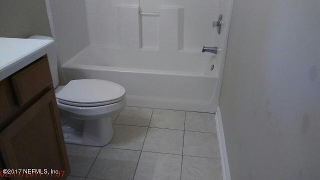 3421 South Saxxon Road St. Augustine, FL 32092 - Photo 13 of 13 a bathroom with a sink a toilet and bathtub