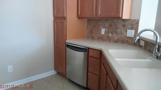 3421 South Saxxon Road St. Augustine, FL 32092 - Photo 4 of 13 a kitchen with a sink and cabinets